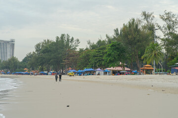 Negeri Sembilan, Malaysia - Sept 26, 2020:  People having fun at Port Dickson. Port Dickson is one of the famous tourist spot in Malaysia.