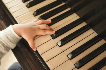 Cute little baby boy plays piano at home © grooveriderz