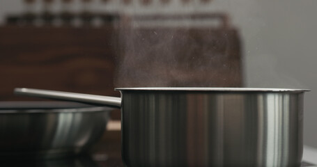 saucepan with boiling water with copy space