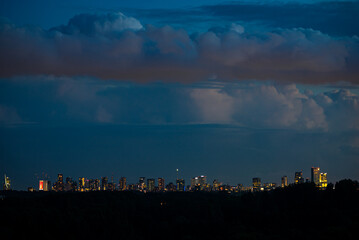 Skyline of Rotterdam, Netherlands during blue hour. Huge storm clouds in the background.