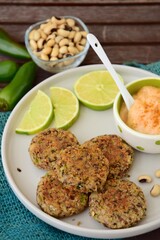 Delicious quinoa jalapeño bean burger patties with chili mayonnaise dip garnish with lime