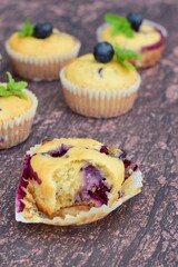 Blueberry coconut muffins garnish with mint leaves, selective focus
