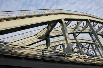  Close-up of a fragment of the arched spans construction of a group of railway bridges over a canal...