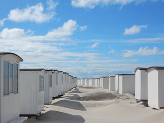beach huts at sunset