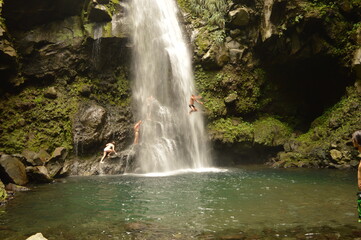 The lush jungle landscapes with waterfalls and black volcanic beaches on the St Vincent and...