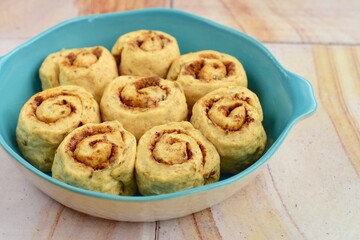Raw cinnamon rolls prepared to bake
