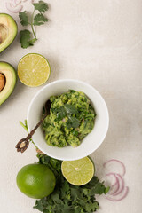 Ingredients guacamole avocado and lime, chili pepper and cilantro, top view