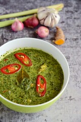 Daun ubi tumbuk or daun singkong or pounded and seasoned cassava leaves. Traditional Indonesian cuisine