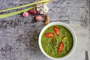Daun ubi tumbuk or daun singkong or pounded and seasoned cassava leaves. Traditional Indonesian cuisine