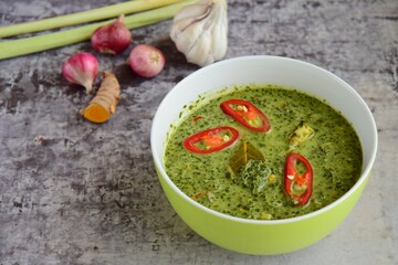 Daun ubi tumbuk or daun singkong or pounded and seasoned cassava leaves. Traditional Indonesian cuisine