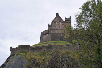 Fototapeta premium View of Old Stone Castle on Hill seen from below