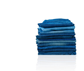 jeans stacked isolated on white background. - 386134764
