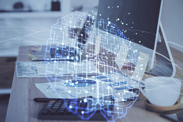 Multi exposure of work space with computer and human brain hologram. Brainstorm concept.