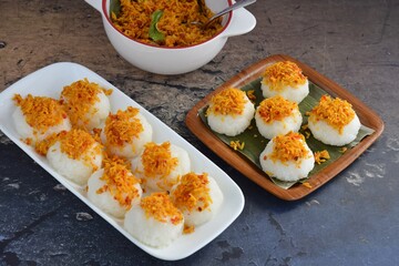 Ketan Serundeng. Indonesian cuisine. Savory steamed cake of glutinous rice with coconut milk, topped with spicy roasted desiccated coconut