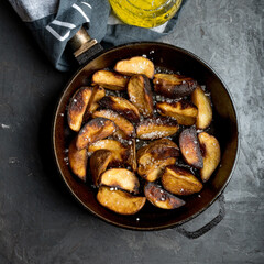 sweet potatoes, baked chicken, potato wedges, iron pan, dark background, pepper onions, french fries, baked potatoes