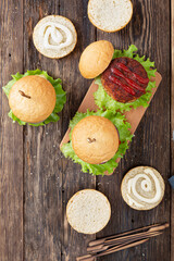 Cooking delicious burgers with grilled cutlet, top view