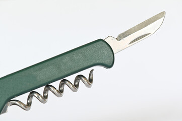 corkscrew and knife isolated on white
