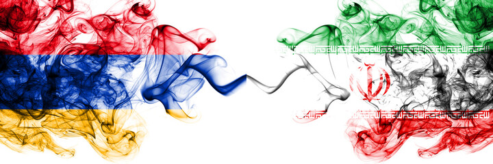 Armenia vs Iran, Iranian smoky mystic flags placed side by side. Thick colored silky abstract smoke flags
