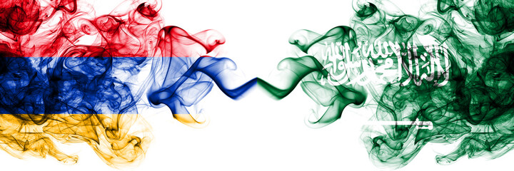 Armenia vs Saudi Arabia, Arabian smoky mystic flags placed side by side. Thick colored silky abstract smoke flags
