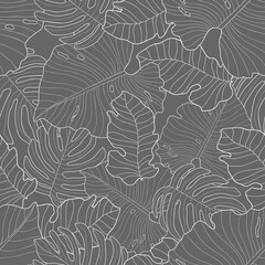 Hand drawn light leaves of monstera and other plants on gray background. Seamless tropical floral pattern. Suitable for wallpaper, textile, packaging.