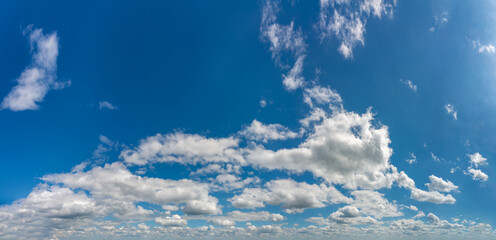 Fantastic clouds against blue sky, panorama