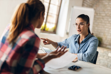 Fototapeta premium Financial advisor talking to potentional client on meeting at workplace