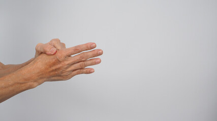 Fototapeta na wymiar Asian Senior or older woman in pain of finger and hand on white background.