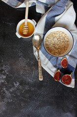 cereal and various delicious ingredients for breakfast on a wood background, flat lay concept. English breakfast