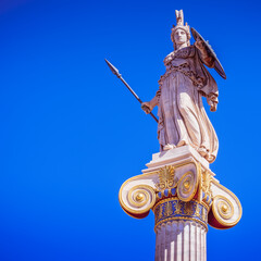 Fototapeta na wymiar Athens Greece, Athena goddess marble statue on plain background, space for your text