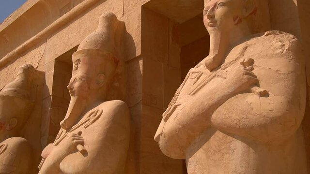 Sculptures of Pharaohs at the entrance on floor three of Hatshepsut's Funerary Temple in Luxor, Egypt.