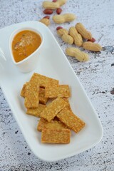 Crispy fried tempeh with homemade peanut sauce