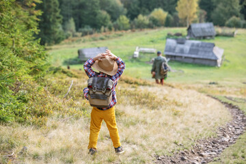 Happy family resting in the mountains in autumn