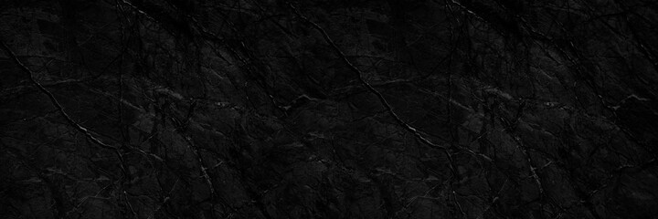 Rock texture. Stone background. Black abstract background. Grunge. Veins and cracks on the rock surface.