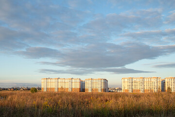 Fototapeta na wymiar Landscape view to new residential houses against sunset sky