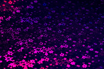 pink, purple, blue holographic stars abstract patterned background