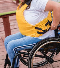 People with disabilities in life vests on the pier.