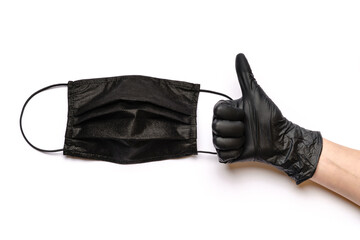 Human hand in protective glove and face protective masks isolated on white background