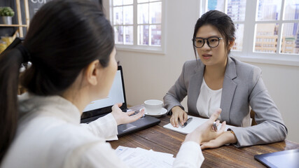 Business women colleagues disputing arguing at corporate meeting in cafe store. mad angry shocked female employee disagree with coworker blaming for bad work. team conflict and rivalry concept