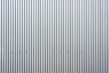 texture of an aluminium wall and concrete wall of a warehouse - obrazy, fototapety, plakaty