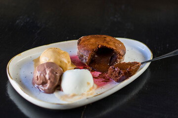Dessert with ice cream and volcano cupcake on the plate