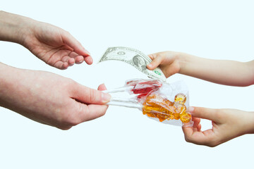 The child's hand holds out a dollar bill for a lollipop. Buying sweets money