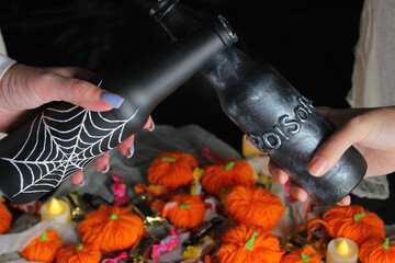 Halloween decoration and toasting with 2 bottles