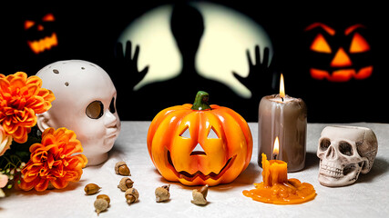 Table with objects to celebrate halloween: candles, pumpkins, on ghostly background