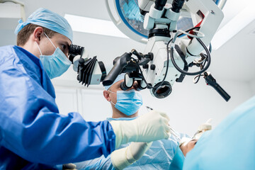 A team of surgeons performing brain surgery to remove a tumor.