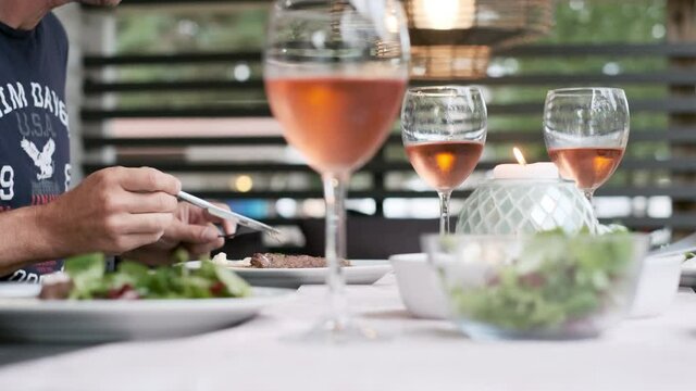 People having cosy summertime dinner