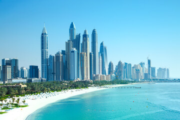 UAE United Arabs Emirates. Dubai marina skyscrapers from from Persian gulf beach line. View at apartment buildings, hotels and offices, modern residential development of UAE