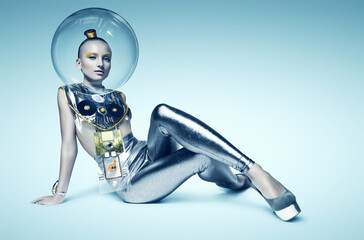 cyborg woman sitting on the floor in glass helmet - obrazy, fototapety, plakaty