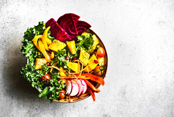 Mango with Kale,Radish and Pomegranate salad bowl