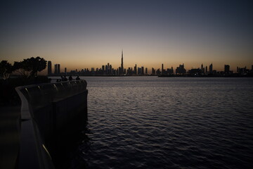 Dubai slyline from Dubai Creek Harbour and Dubai canal to Downtown and Business Bay, United Arab...