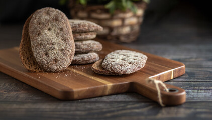 Rye bread on a wooden table. A crust of bread. Close-up. Cutting board. Diet.